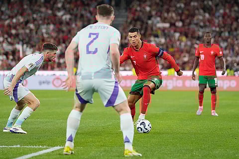 2024–25 UEFA Nations League, Portugal vs Scotland: Portugal's Cristiano Ronaldo, centre right, controls the ball